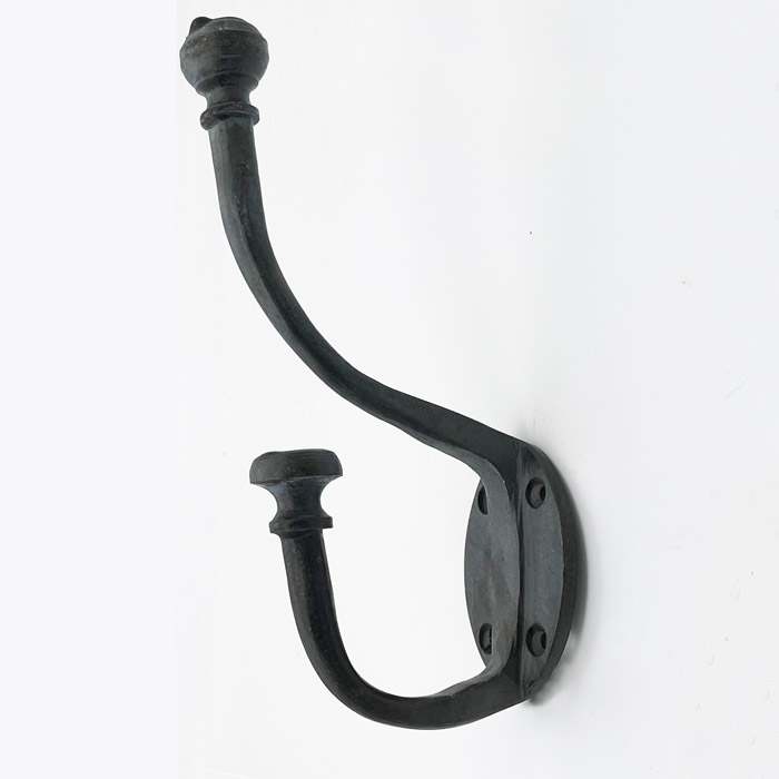 A wrought iron hat and coat hook
